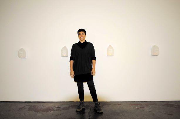 Laura Ortiz Vega in front of altarpiece at Tube Factory artspace